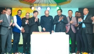 Ambassador of India to Qatar H E Vipul (centre) cutting a cake to mark the 76th Republic Day of India at ICC premises yesterday.