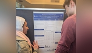 Jannah Elgamal (left) explaining her research.