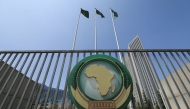 File: The African Union logo is seen outside the AU headquarters building in Addis Ababa, Ethiopia, on November 8, 2021.

