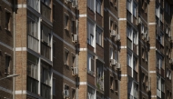 In this representational file photo, air conditioners are seen on the facade of a residential building in Malaga, southern Spain, on July 28, 2023. (Photo by JORGE GUERRERO / AFP)