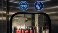 This photograph taken on January 26, 2023 shows cans of Cola at the closing stage at the Coca Cola factory in Bierne, northern France. (Photo by Sameer Al Doumy / AFP)
