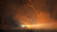 A handout photo from VicEmergency/state control centre taken and released on January 27, 2025 shows a fire truck arriving to battle bushfires in Little Desert National Park in the Australian state of Victoria. (Photo by Handout / VicEmergency/state control centre / AFP)