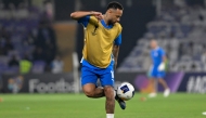 (FILES) Hilal's Brazilian forward #10 Neymar controls the ball as he warms up ahead of the AFC Champions League group B football match between UAE's Al-Ain and Saudi's Al-Hilal at the Hazza bin Zayed Stadium in al-Ain on October 21, 2024. (Photo by Adel AL-NAIMI / AFP)
