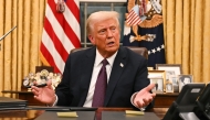 US President Donald Trump speaks to journalists about TikTok as he signs executive orders in the Oval Office of the White House in Washington, DC, on January 20, 2025. (Photo by Jim WATSON / POOL / AFP)
