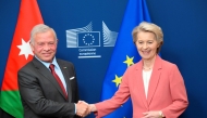 President of the European Commission Ursula von der Leyen (R) shakes hands with Jordan's King Abdullah II (L) before a meeting at the EU headquarters in Brussels on January 29, 2025. (Photo by Nicolas Tucat / AFP)