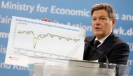 German Minister of Economics and Climate Protection Robert Habeck holds a graphic depicting the development of Germany's price-adjusted gross domestic product as he addresses a press conference to present the annual economic report 2025 at his ministry in Berlin on January 29, 2025. (Photo by Odd ANDERSEN / AFP)