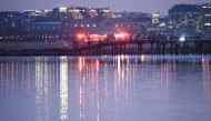 Emergency response units assemble at Ronald Reagan Washington Airport as search and rescue operations are underway in the Potomac River on January 30, 2025 in Arlington, Virginia. Win McNamee/Getty Images/AFP