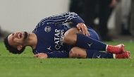 Paris Saint-Germain's French midfielder #33 Warren Zaire-Emery reacts after sustaining an injury during the UEFA Champions League football match VfB Stuttgart vs Paris Saint-Germain in Stuttgart, southwestern Germany, on January 29, 2025. (Photo by FRANCK FIFE / AFP)
