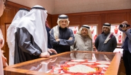 Prime Minister and Minister of Foreign Affairs H E Sheikh Mohammed bin Abdulrahman bin Jassim Al Thani with other dignitaries visiting one of the pavilions during the opening of the Doha Jewellery & Watches Exhibition 2025 at the Doha Exhibition and Convention Center yesterday.