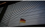 The German national flag is seen through a Venetian blind at the Bundestag (lower house of parliament) in Berlin on January 31, 2025. (Photo by Tobias SCHWARZ / AFP)