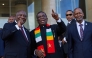 (From left) South African President Cyril Ramaphosa, President of Zimbabwe and SADC Chairman Emmerson Mnangagwa and SADC Executive Secretary Elias Magosi gesture ahead of the Southern African Development Community (SADC) extraordinary summit in Harare on January 31, 2025.  (Photo by Jekesai Njikizana / AFP)