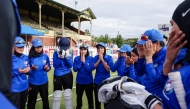 Afghanistan Women's XI players say a prayer before the cricket match between Afghanistan Women's XI and Cricket Without Borders XI at Junction Oval in Melbourne on January 30, 2025. (Photo by Martin Keep / AFP)