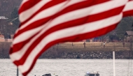 Recovery teams search the wreckage after the crash of an American Airlines plane on the Potomac River as it approached the airport on January 30, 2025 in Arlington, Virginia. (Photo by Al Drago/Getty Images/AFP)
