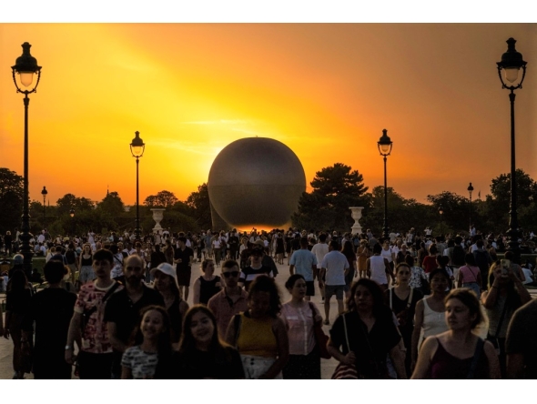 File: Visitors gather in front of the Olympic cauldron, an air balloon, lit with the Olympic flame in Paris on July 30, 2024. (Photo by Andrej Isakovic / AFP)