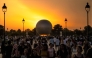 File: Visitors gather in front of the Olympic cauldron, an air balloon, lit with the Olympic flame in Paris on July 30, 2024. (Photo by Andrej Isakovic / AFP)