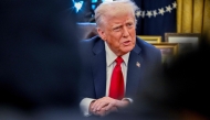 US President Donald Trump speaks to the press after signing an executive order in the Oval Office of the White House on January 30, 2025 in Washington, DC. (Photo by Roberto Schmidt / AFP)