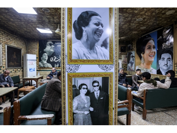 People sit at the Umm Kulthum cafe in the old city of Baghdad on January 27, 2025. (Photo by AHMAD AL-RUBAYE / AFP)
