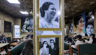 People sit at the Umm Kulthum cafe in the old city of Baghdad on January 27, 2025. (Photo by AHMAD AL-RUBAYE / AFP)
