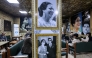 People sit at the Umm Kulthum cafe in the old city of Baghdad on January 27, 2025. (Photo by AHMAD AL-RUBAYE / AFP)
