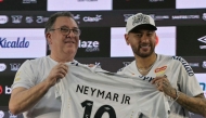 Brazilian football star Neymar (R) and the President of Santos, Marcelo Pirilo Teixeira, at the Urbano Caldeira Stadium in Santos, Sao Paulo state, Brazil on January 31, 2025. (Photo by NELSON ALMEIDA / AFP)