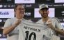 Brazilian football star Neymar (R) and the President of Santos, Marcelo Pirilo Teixeira, at the Urbano Caldeira Stadium in Santos, Sao Paulo state, Brazil on January 31, 2025. (Photo by NELSON ALMEIDA / AFP)