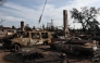 Vehicles which burned in the Eaton Fire are marked 'NOT EV' as EPA hazardous materials disposal ramp up on January 31, 2025 in Altadena, California. Mario Tama/Getty Images/AFP