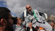 A former Palestinian prisoner is cheered upon his arrival in Ramallah on buses of the International Committee of the Red Cross (ICRC) on February 1, 2025. (Photo by Ahmad Gharabli / AFP)
