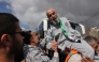 A former Palestinian prisoner is cheered upon his arrival in Ramallah on buses of the International Committee of the Red Cross (ICRC) on February 1, 2025. (Photo by Ahmad Gharabli / AFP)
