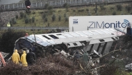 Police and emergency crews search through the debris of a crushed wagon for second day after a train accident in the Tempi Valley near Larissa, Greece, March 2, 2023. (Photo by Sakis MITROLIDIS / AFP)