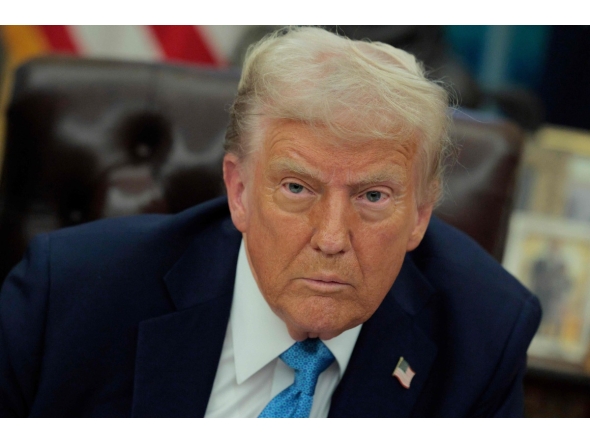 U.S. President Donald Trump talks to reporters after signing an executive order, 