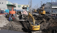 Excavators and rescue personnel working to construct a slope for rescue operations are seen at the site where a truck on January 28 plunged into a sinkhole, trapping the vehicle's driver, in Yashio, Saitama Prefecture on February 1, 2025. Photo by JIJI PRESS / AFP