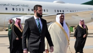 A handout picture released by the official Syrian Arab News Agency (SANA) on February 2, 2025, shows Syria's interim president Ahmed al-Sharaa (L), received by Prince Mohammed bin Abdulrahman bin Abdulaziz, Deputy Governor of Riyadh region, upon their arrival in Riyadh on his first foreign visit. (Photo by SANA / AFP) /