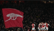 Arsenal's English midfielder #53 Ethan Nwaneri celebrates with teammates after scoring their fifth goal during the English Premier League football match between Arsenal and Manchester City at the Emirates Stadium in London on February 2, 2025. (Photo by Glyn KIRK / AFP)