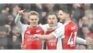 Martin Odegaard (left) celebrates with teammates after scoring Arsenal’s opening goal. 