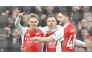 Martin Odegaard (left) celebrates with teammates after scoring Arsenal’s opening goal. 