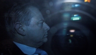 N-VA chairman Bart De Wever is seen behind a window as he arrives in his car for a meeting with King Filip of Belgium to discuss the negotiations to form a federal government at the Royal Palace in Brussels on January 31, 2025. Photo by Simon Wohlfahrt / AFP.