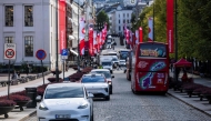 (FILES) Oslo Taxi's Tesla model Y (L) and the NIO ET5 electric vehicle from Nio Inc, a Chinese multinational electric car manufacturer, drive through the Norwegian capital Oslo, on September 27, 2024. (Photo by Jonathan NACKSTRAND / AFP)
