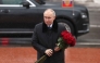 In this pool photograph distributed by the Russian state agency Sputnik, Russian President Vladimir Putin lays flowers at the monument 'Rubezhny Kamen' (Boundary Stone) in Kirovsk, Leningrad region, on January 27, 2025. (Photo by Vyacheslav Prokofyev / POOL / AFP)