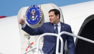 US Secretary of State Marco Rubio boards a plane en route to El Salvador at Panama Pacifico International Airport in Panama City on February 3, 2025. (Photo by Mark Schiefelbein / Pool AP / AFP)
