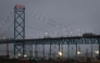 Trucks carry goods across the Ambassador Bridge from Canada into the United States on February 03, 2025 in Detroit, Michigan. Scott Olson/Getty Images/AFP