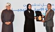 Minister of Social Development and Family H E Buthaina bint Ali Al Jabr Al Nuaimi presents a special memento to Shanvas Padiyath, Regional Manager of Lulu Qatar as Chairman of QCS Sheikh Dr. Khalid bin Jaber Al Thani looks on.