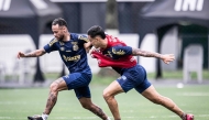 In this handout picture released by Santos Football Club, Brazil's forward Neymar fights for the ball on during a training session at Rei Pele training centre, in Santos, Brazil on February 3, 2025. (Photo by Raul Baretta / Brazil's Santos FC / AFP) 