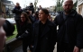 Chelsea's Australian striker Sam Kerr (C) reacts as she arrives at Kingston Crown Court in south London on February 3, 2025, for the start of her trial. (Photo by HENRY NICHOLLS / AFP)
