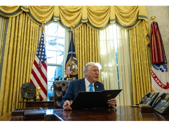 US President Donald Trump speaks to the press as he signs executive orders in the Oval Office of the White House on February 4, 2025 in Washington, DC. (Photo by ANDREW CABALLERO-REYNOLDS / AFP)
