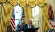 US President Donald Trump speaks to the press as he signs executive orders in the Oval Office of the White House on February 4, 2025 in Washington, DC. (Photo by ANDREW CABALLERO-REYNOLDS / AFP)
