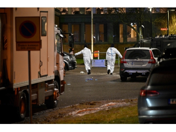 Forensic police officers work at the scene of the Risbergska School in Orebro, Sweden, on February 4, 2025, following reports of a serious violent crime. (Photo by Pontus Lundahl / TT News Agency / AFP) 