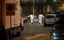 Forensic police officers work at the scene of the Risbergska School in Orebro, Sweden, on February 4, 2025, following reports of a serious violent crime. (Photo by Pontus Lundahl / TT News Agency / AFP) 