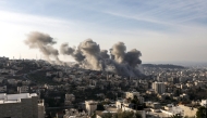 Smoke billows from the site of several explosions during an Israeli raid on the Jenin camp for Palestinian refugees on February 2, 2025. (Photo by MOHAMMAD MANSOUR / AFP)
