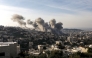 Smoke billows from the site of several explosions during an Israeli raid on the Jenin camp for Palestinian refugees on February 2, 2025. (Photo by MOHAMMAD MANSOUR / AFP)
