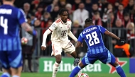 Bayern Munich's French forward #39 Mathys Tel and Slovan Bratislava's Panamanian defender #28 Cesar Blackman vie for the ball during the UEFA Champions League football match between FC Bayern Munich and SK Slovan Bratislava in Munich, southern Germany, on January 29, 2025. (Photo by Alexandra BEIER / AFP)
